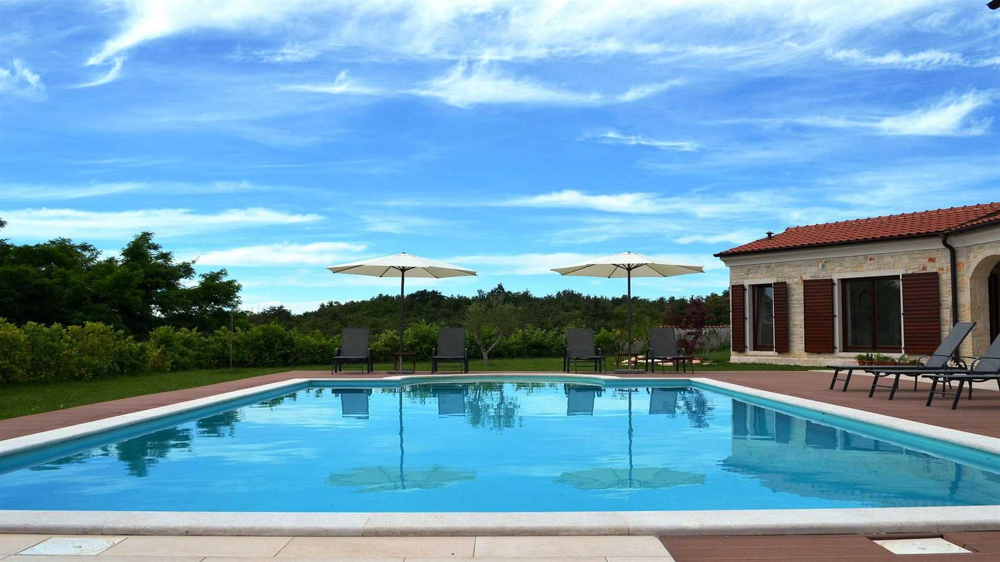 Spacious poolside villa with beautiful garden