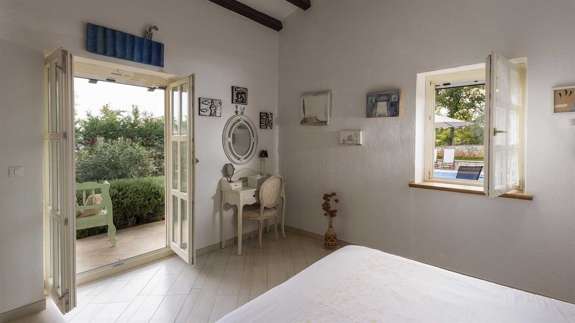 Lovely poolside villa with beautiful garden in Tinjan