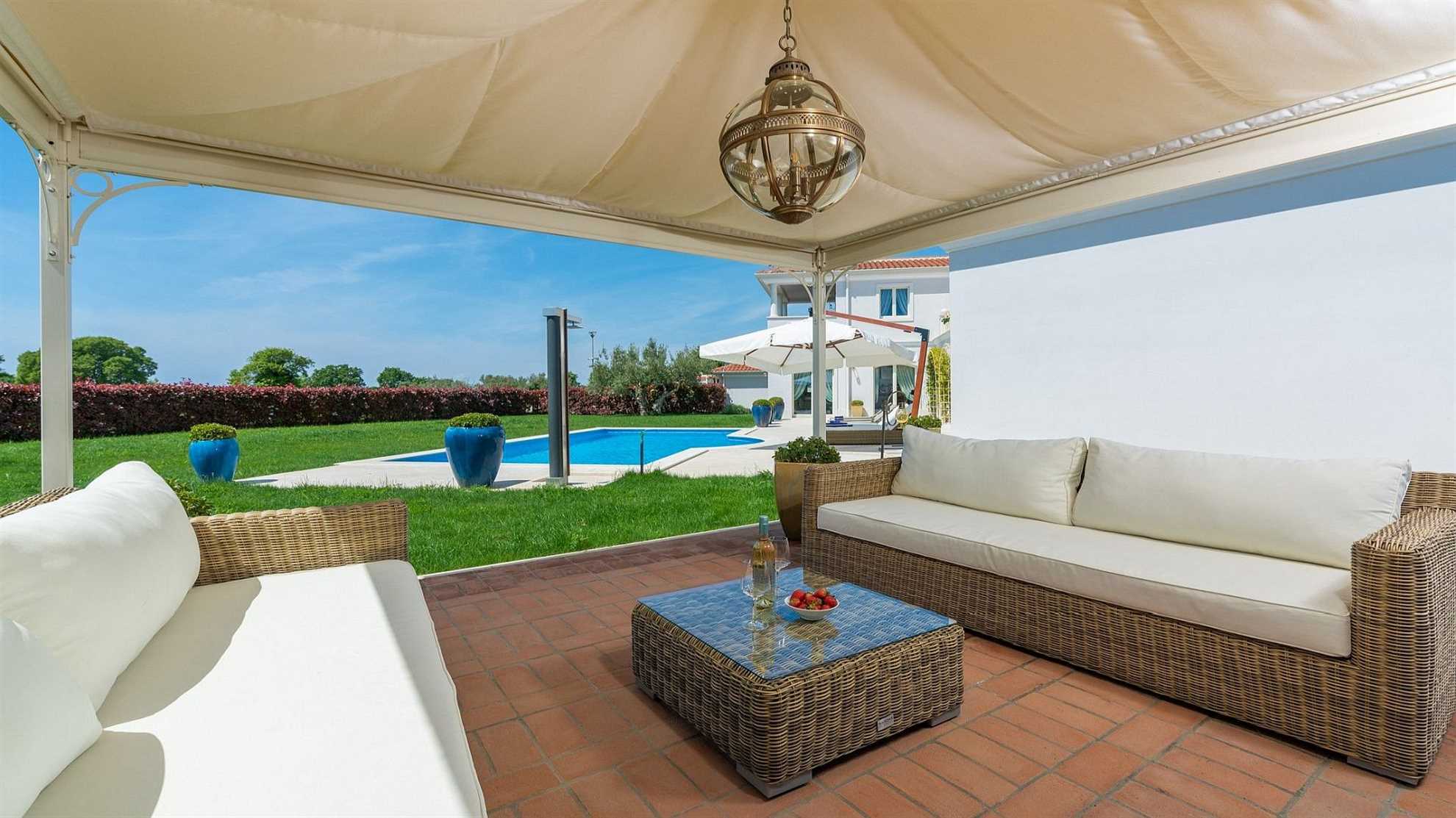A modern villa in Vabriga with a pool and a graden