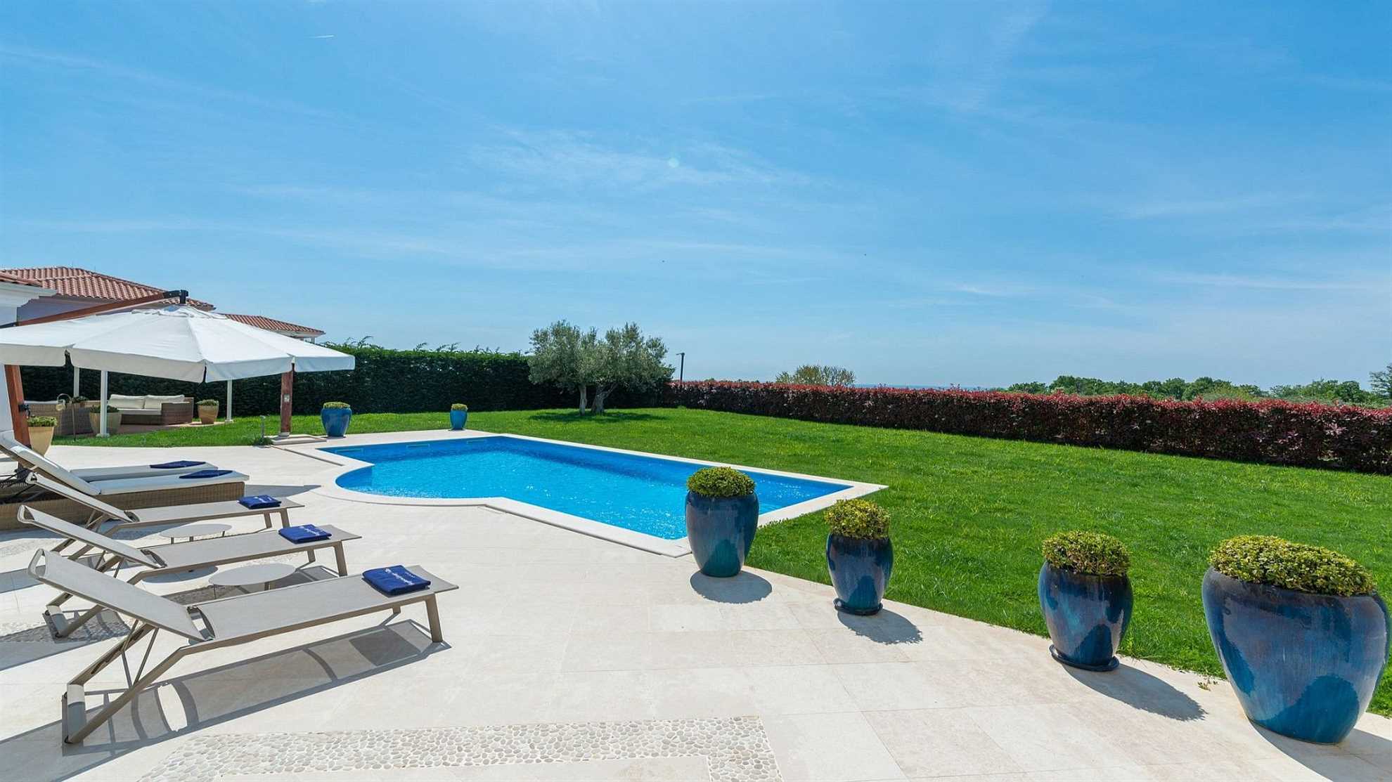A modern villa in Vabriga with a pool and a graden