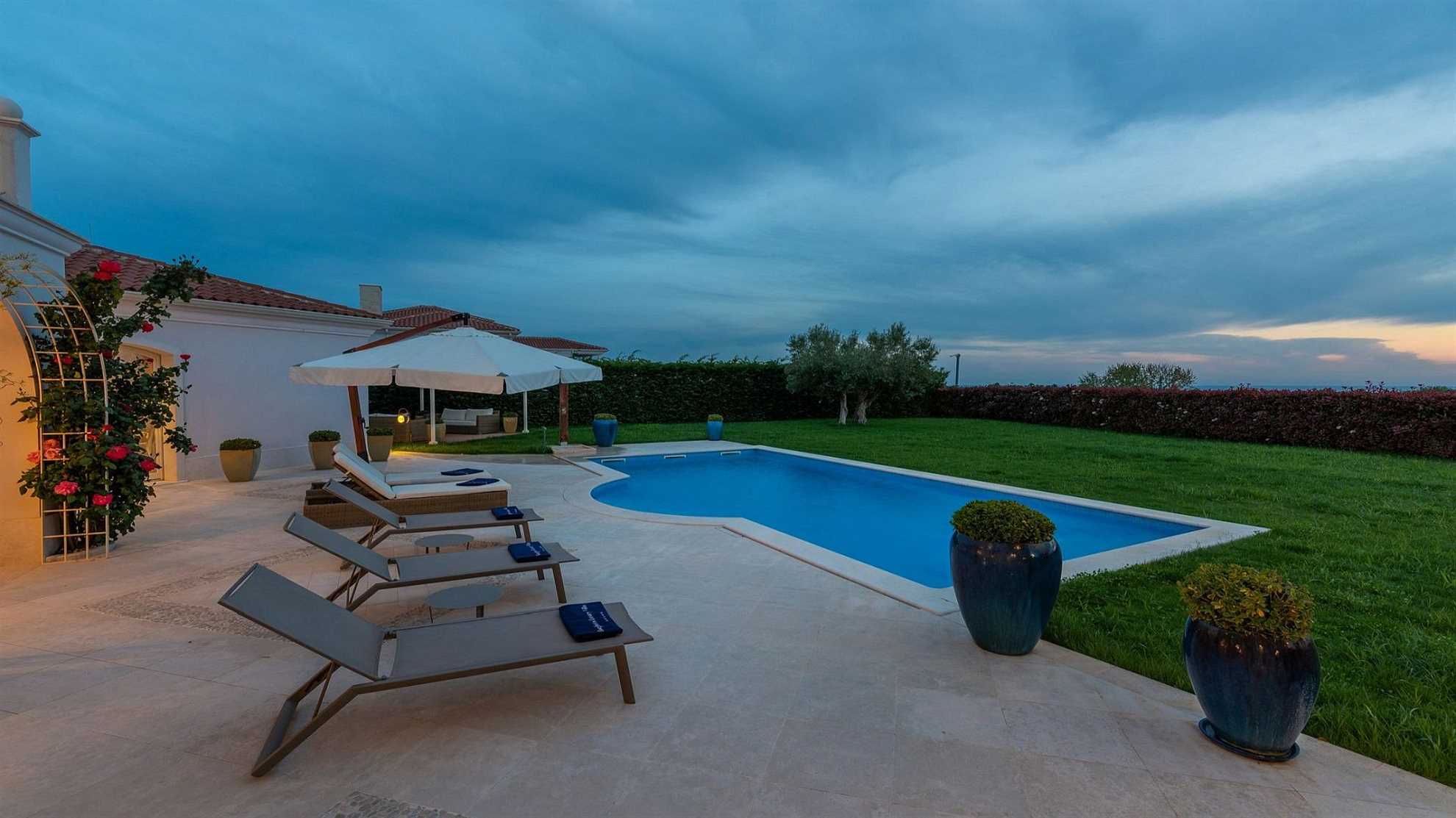 A modern villa in Vabriga with a pool and a graden