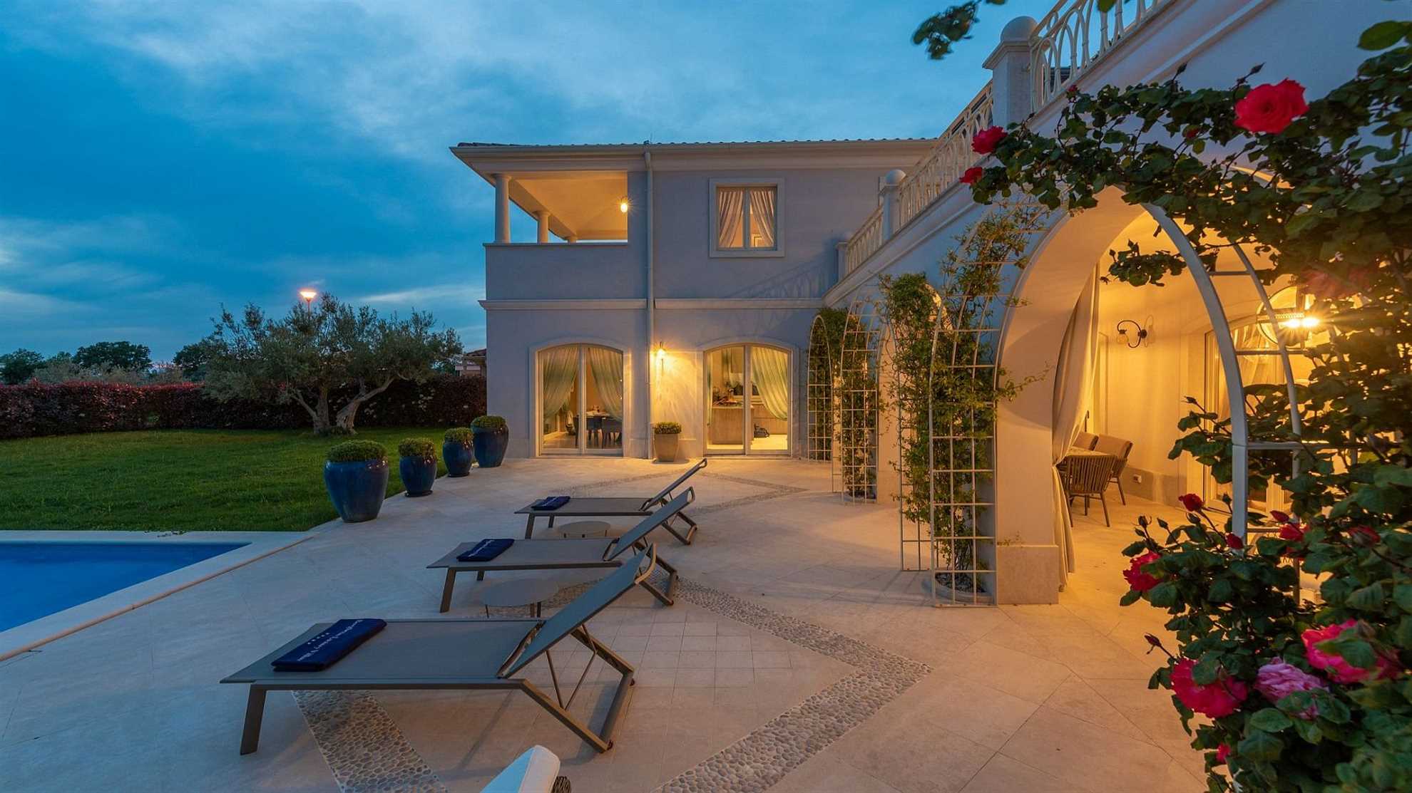 A modern villa in Vabriga with a pool and a graden