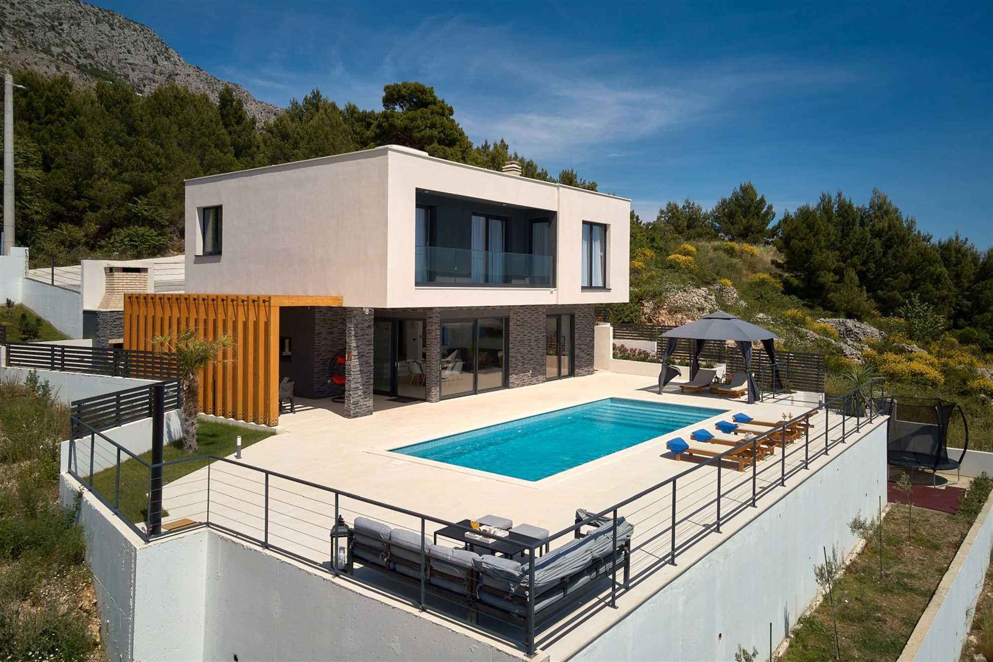A modern villa with a pool and an amazing sea view