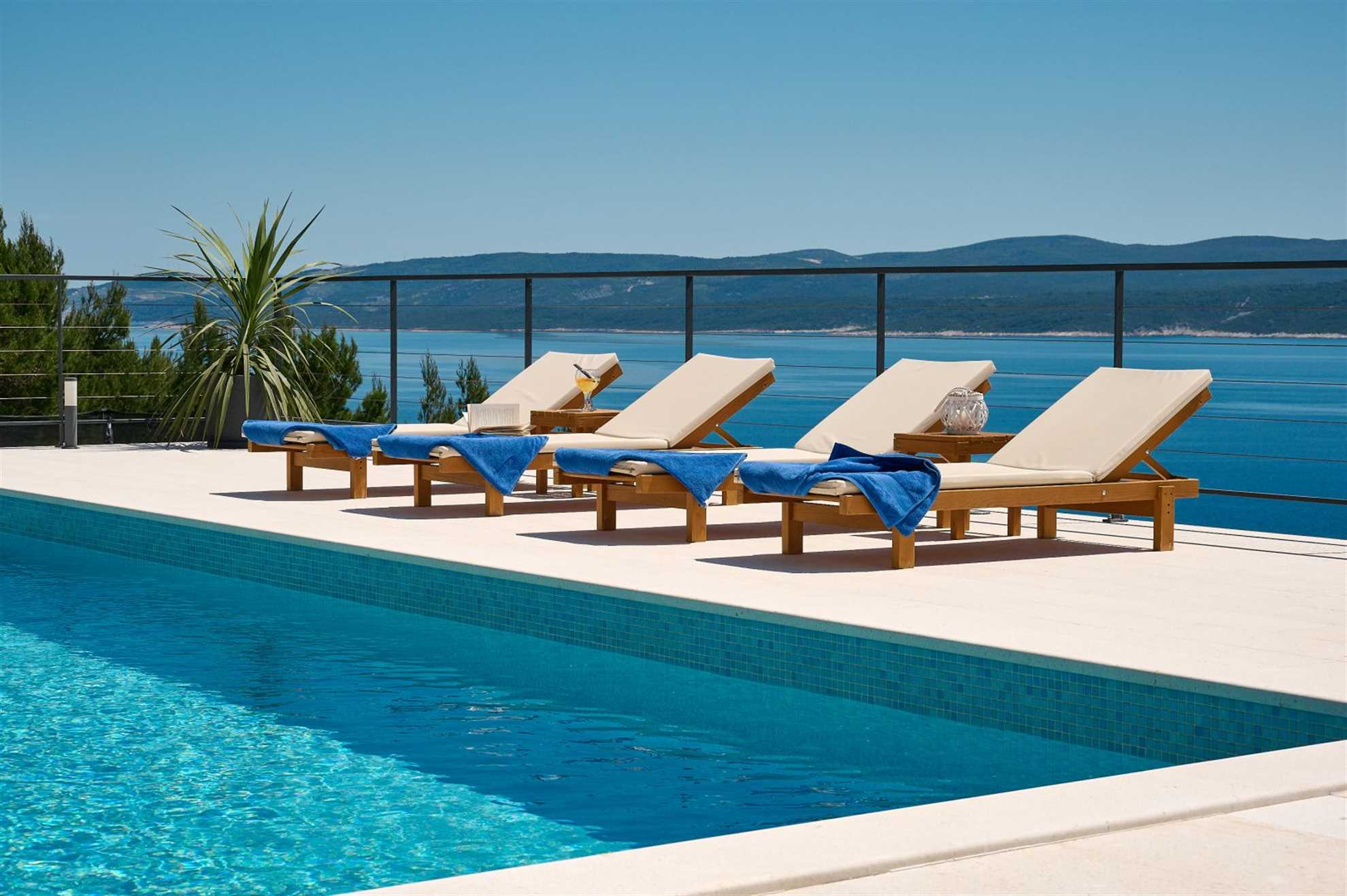 A modern villa with a pool and an amazing sea view
