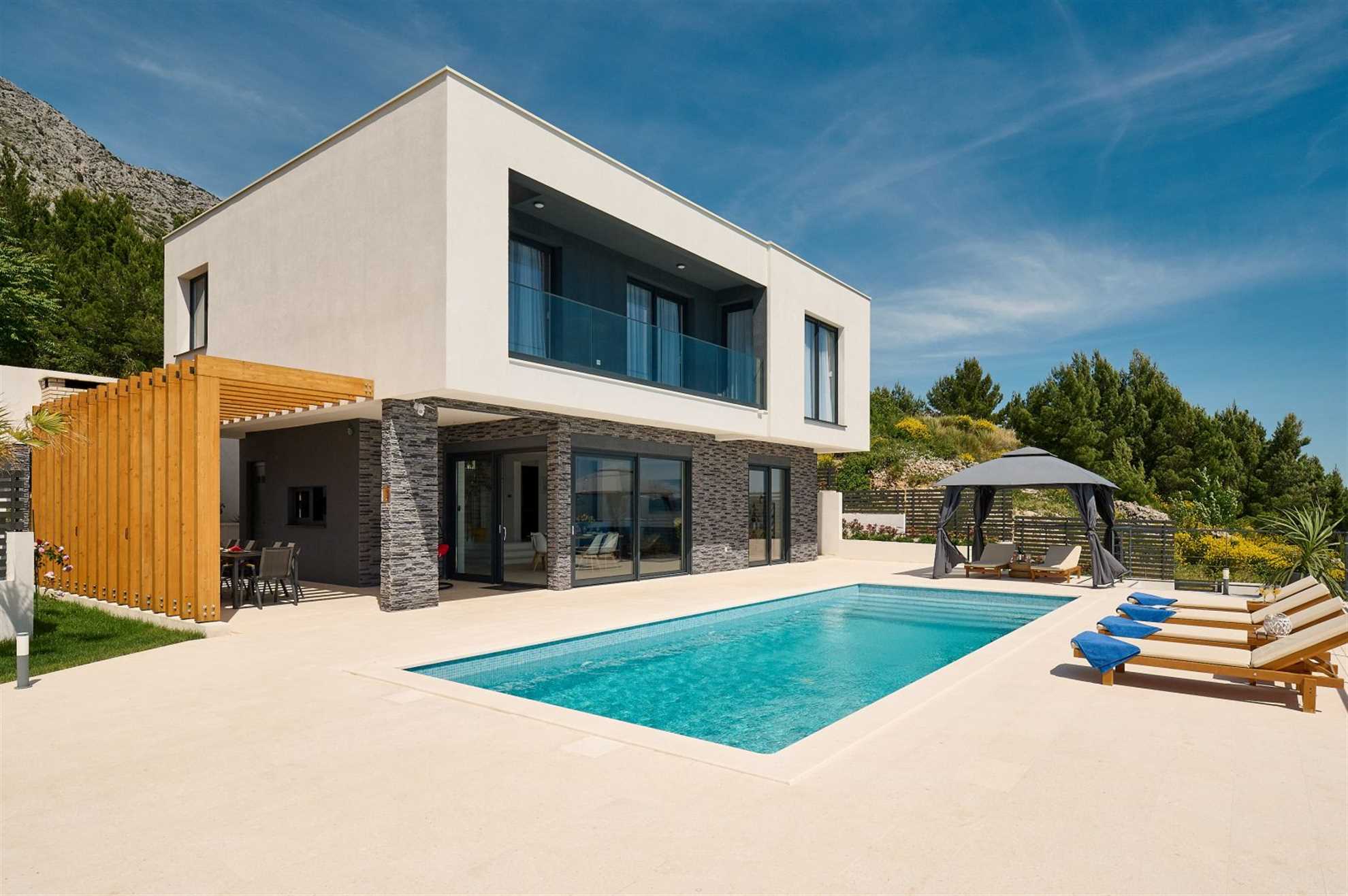 A modern villa with a pool and an amazing sea view