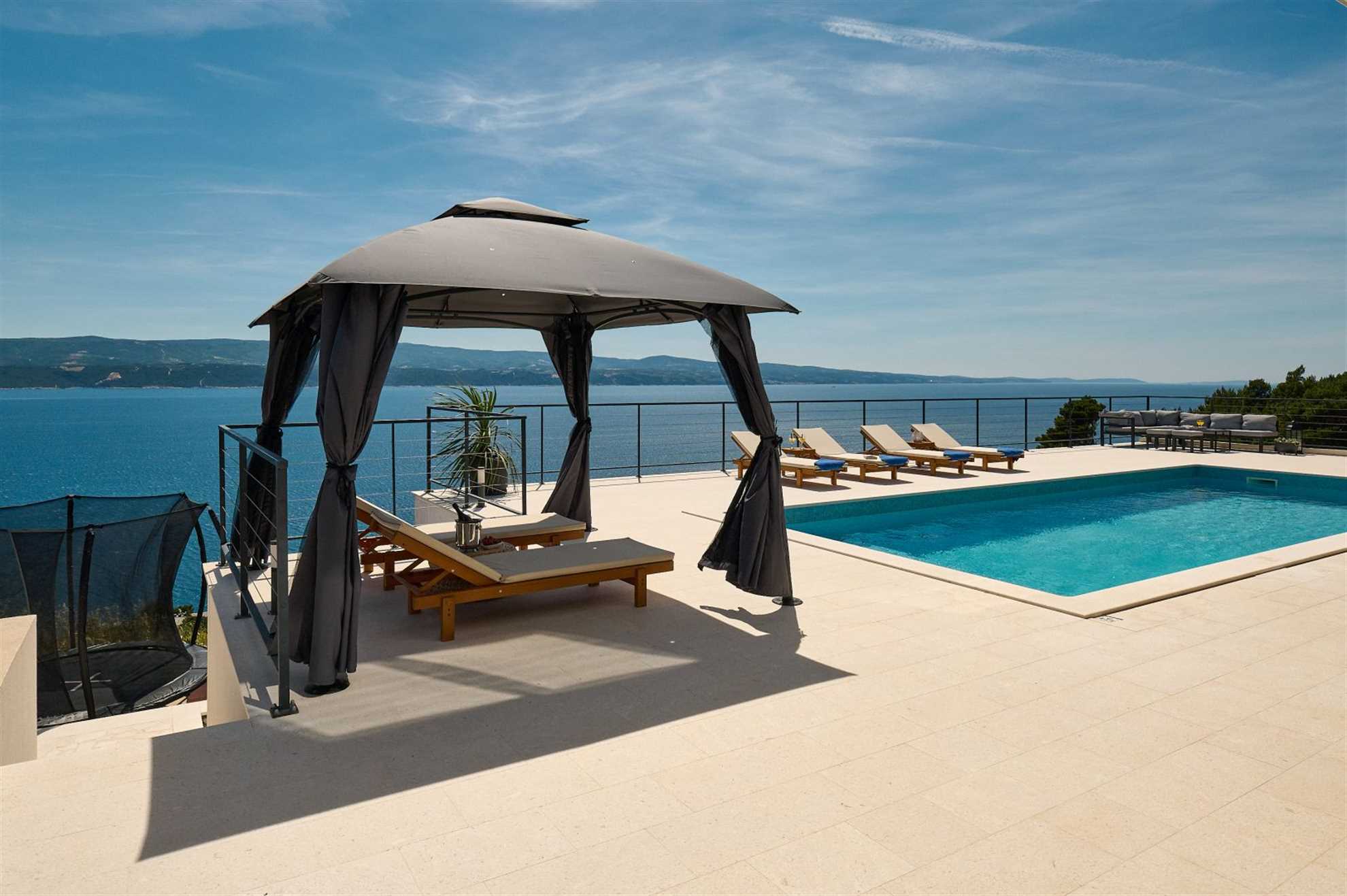 A modern villa with a pool and an amazing sea view