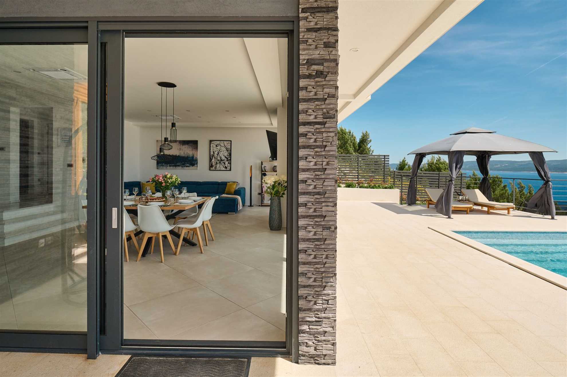 A modern villa with a pool and an amazing sea view