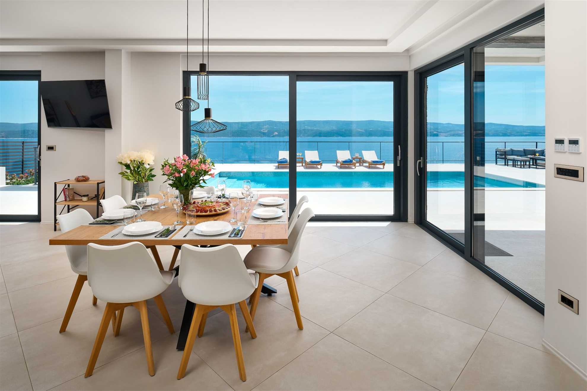 A modern villa with a pool and an amazing sea view
