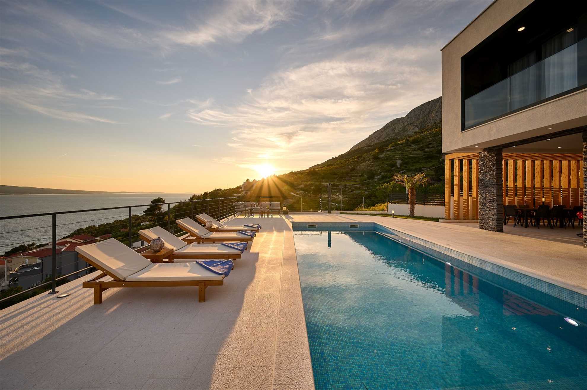 A modern villa with a pool and an amazing sea view
