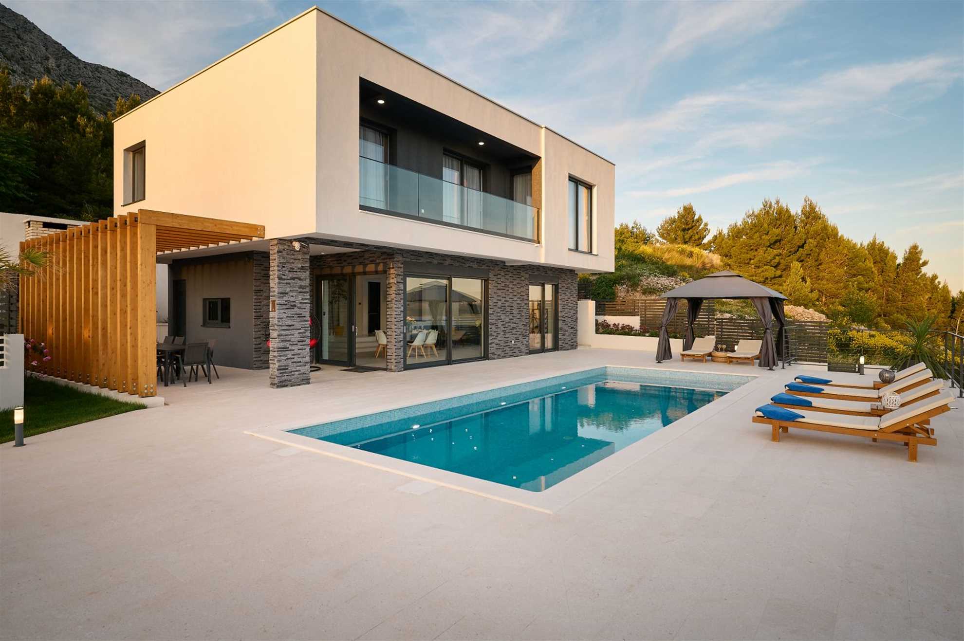 A modern villa with a pool and an amazing sea view