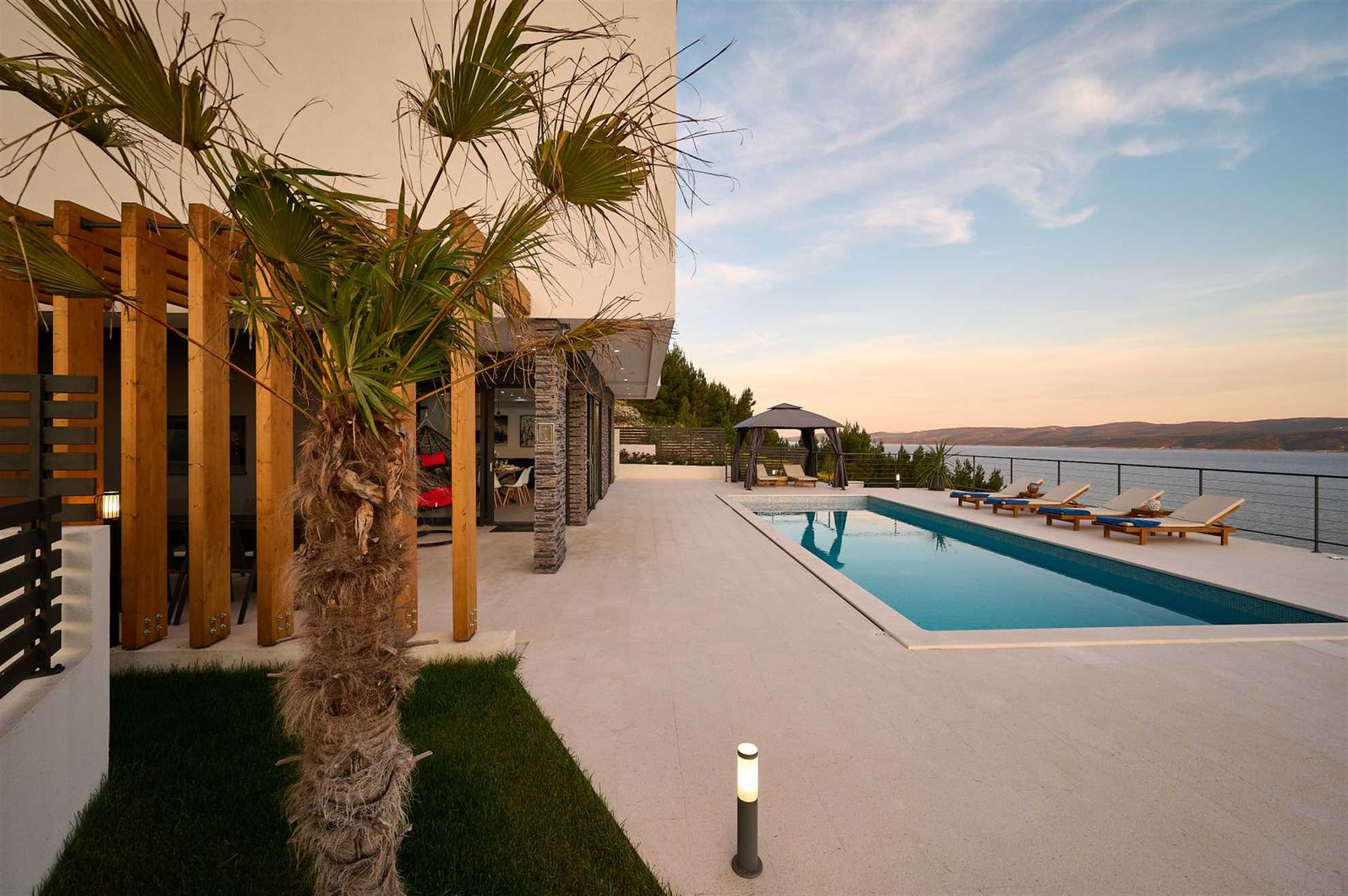 A modern villa with a pool and an amazing sea view
