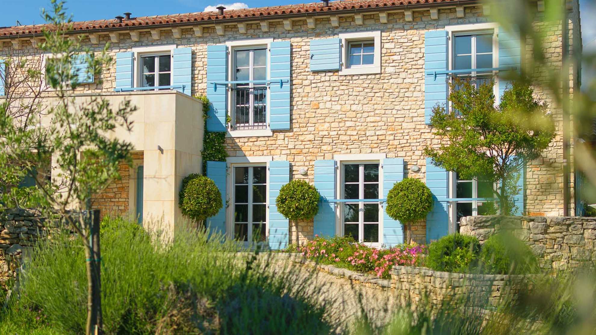 A traditional, stone villa in Marčana with a pool and children's playground
