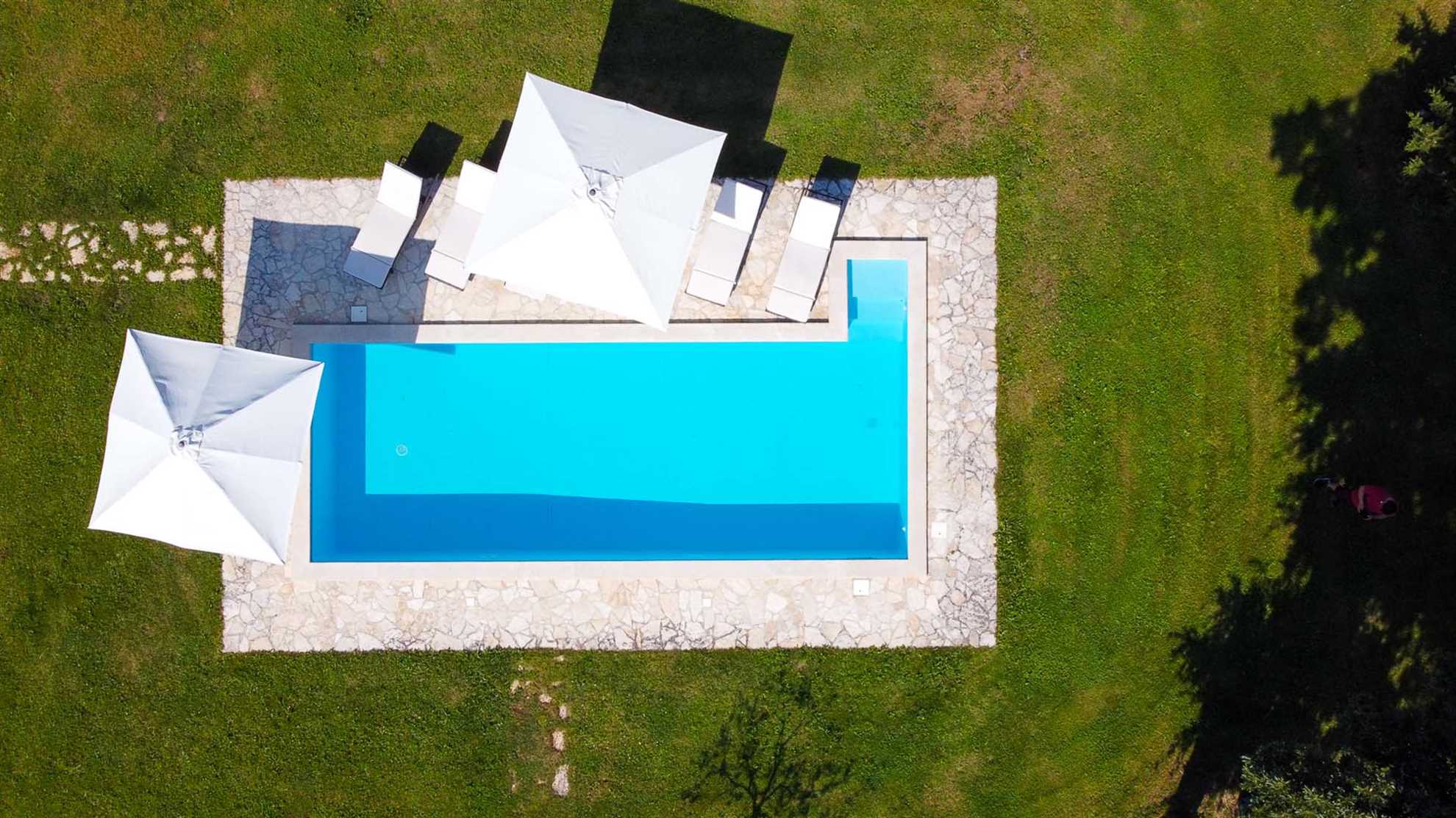 A traditional, stone villa in Marčana with a pool and children's playground