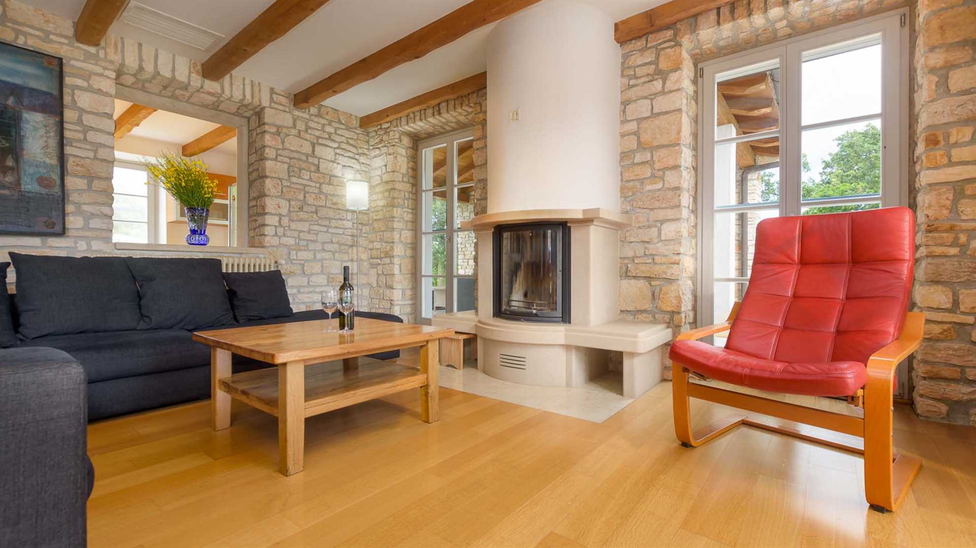A traditional, stone villa in Marčana with a pool and children's playground