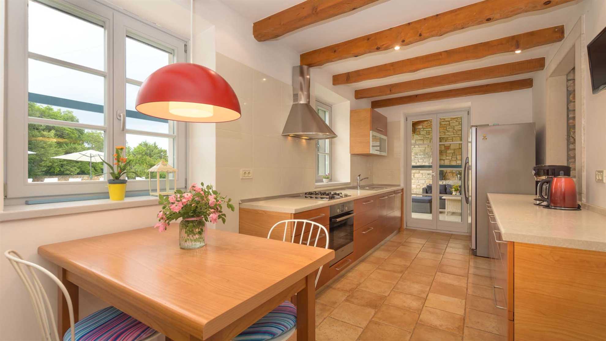 A traditional, stone villa in Marčana with a pool and children's playground