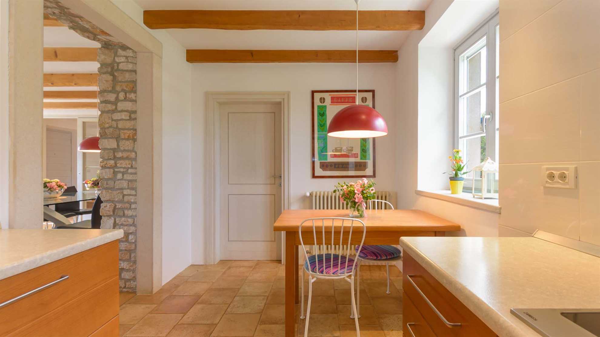 A traditional, stone villa in Marčana with a pool and children's playground