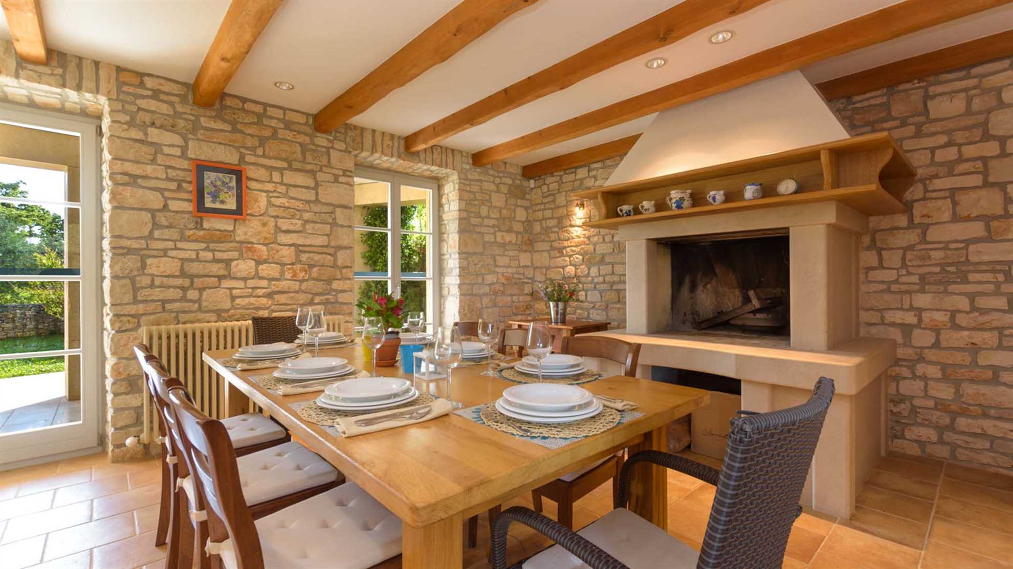 A traditional, stone villa in Marčana with a pool and children's playground