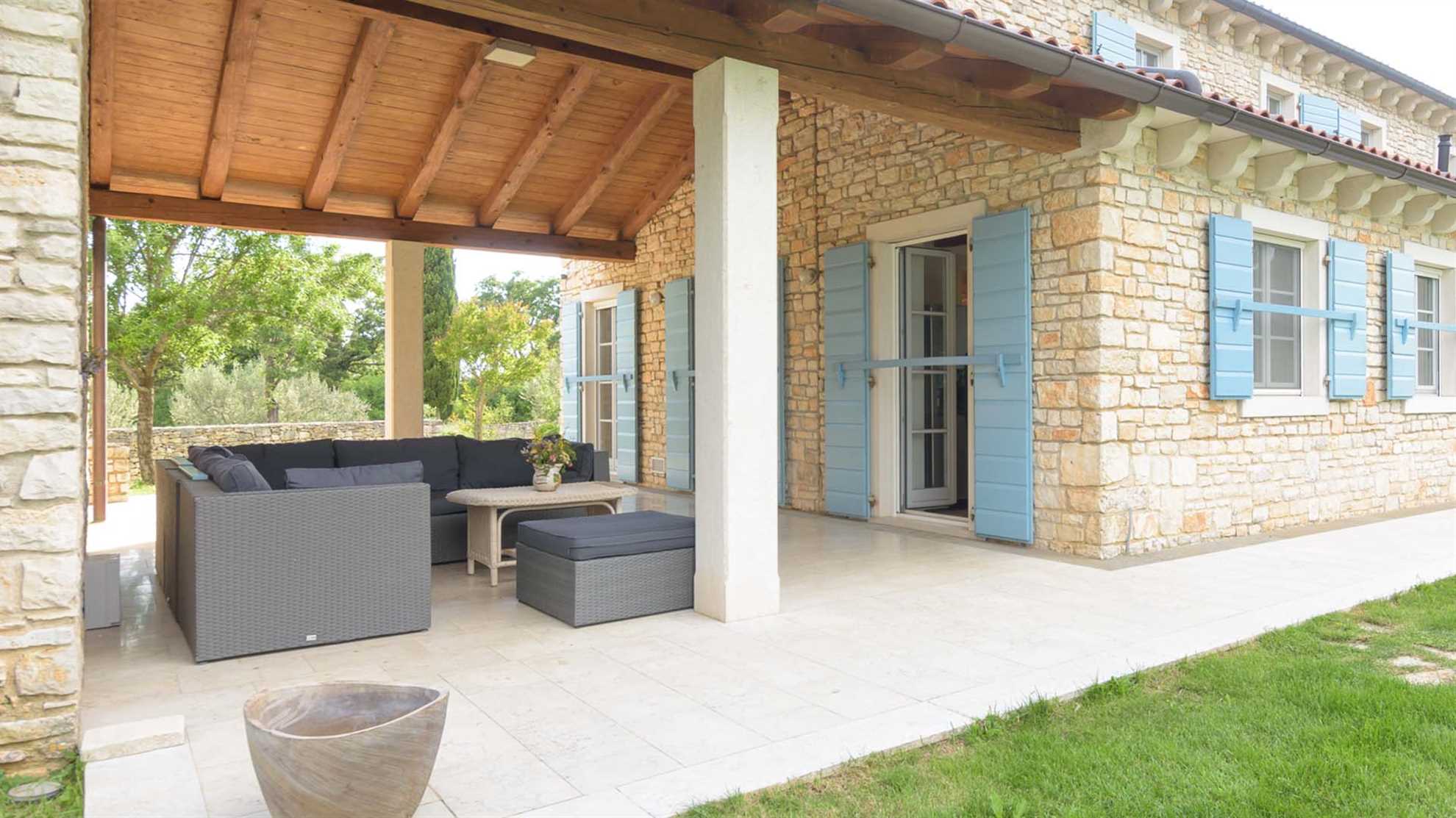 A traditional, stone villa in Marčana with a pool and children's playground