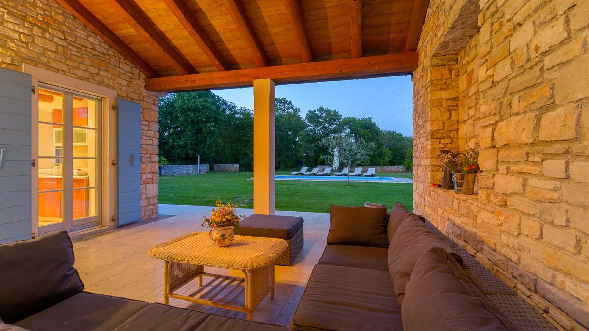 A traditional, stone villa in Marčana with a pool and children's playground