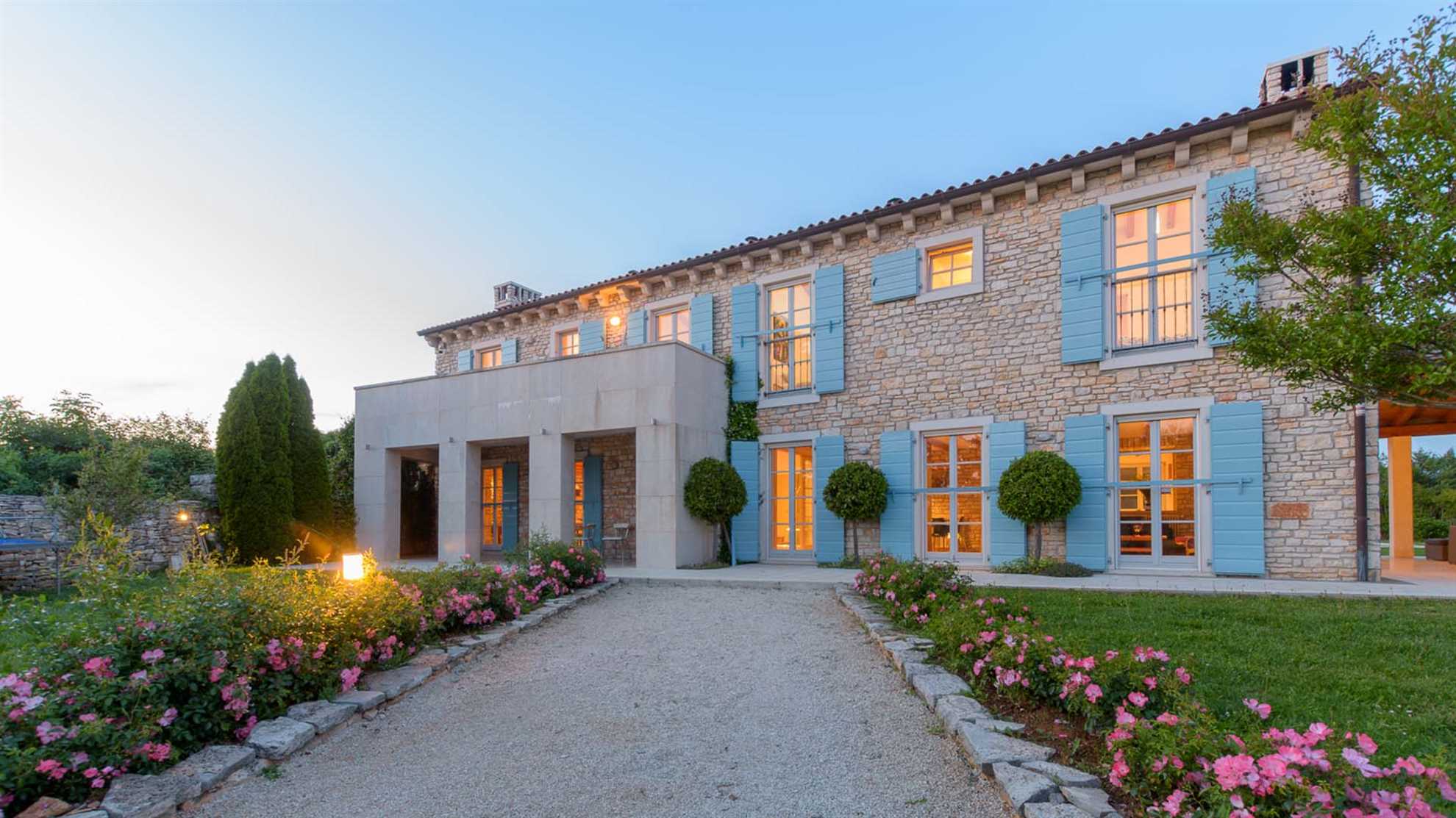A traditional, stone villa in Marčana with a pool and children's playground