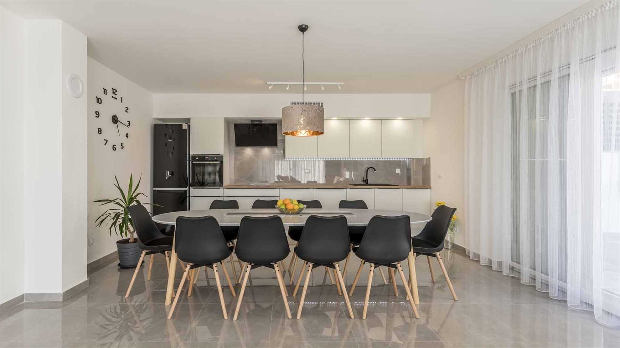A modern villa in Podstrana with a pool