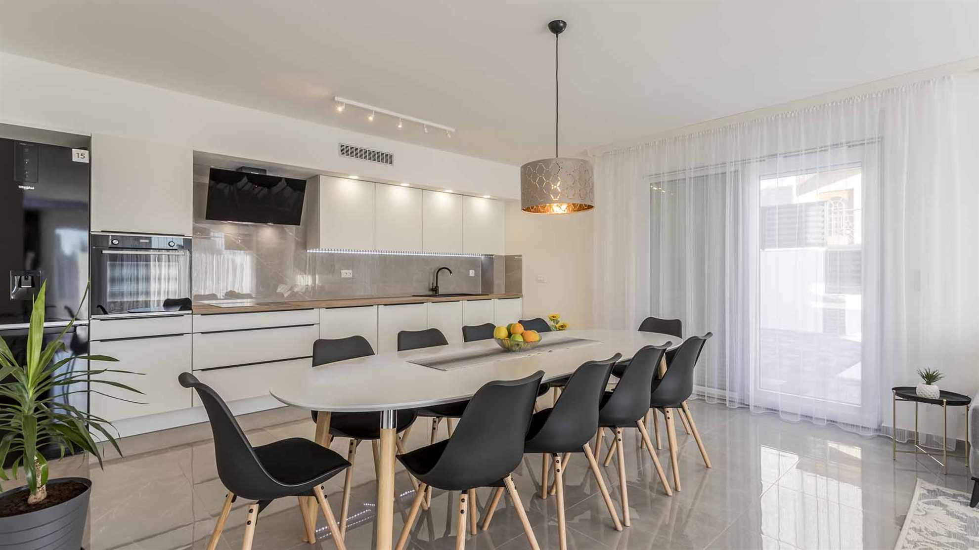A modern villa in Podstrana with a pool