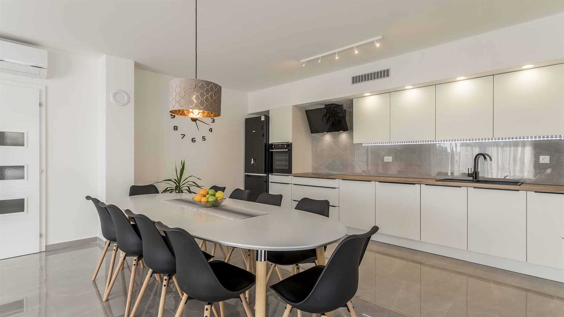 A modern villa in Podstrana with a pool
