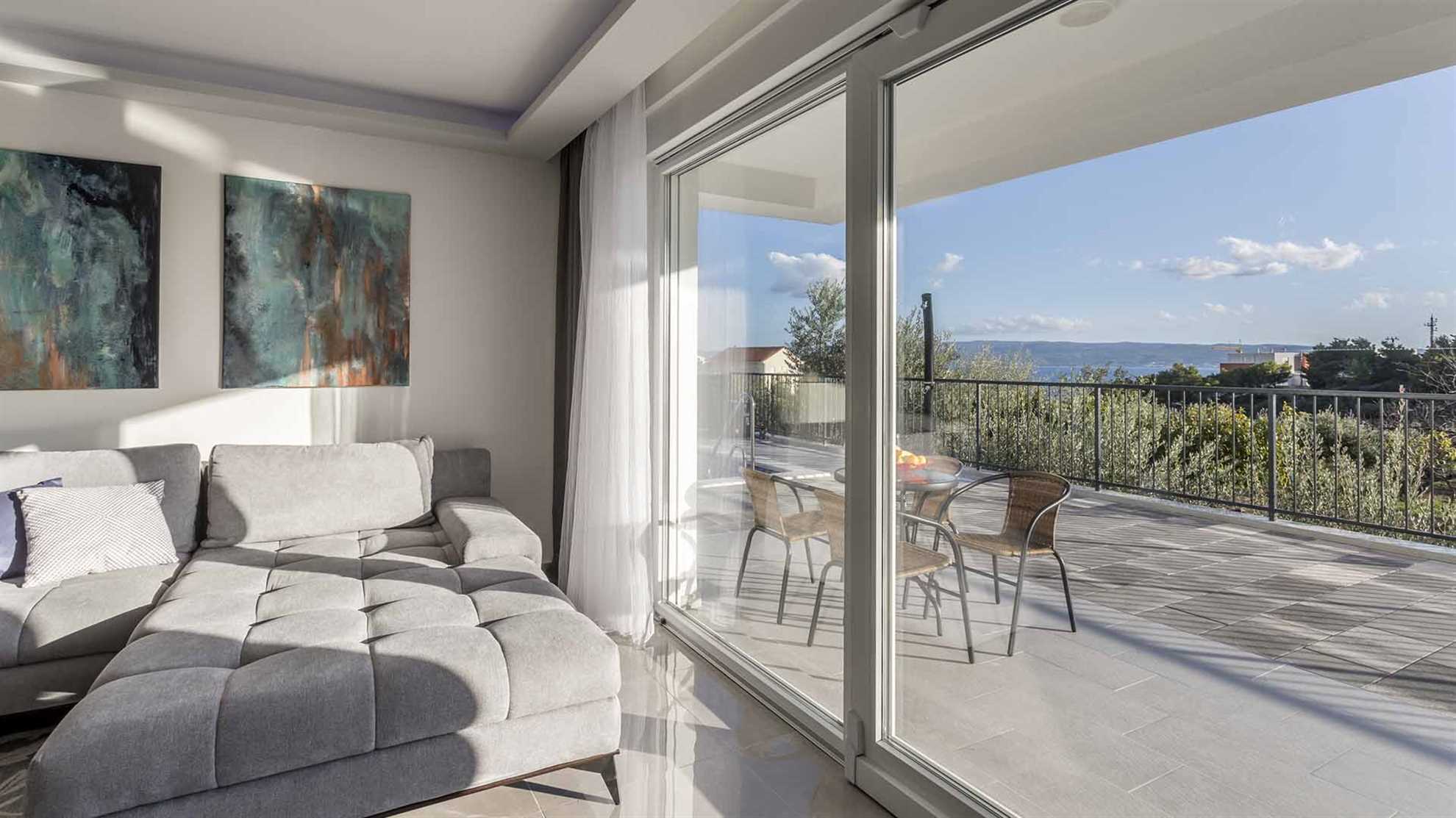 A modern villa in Podstrana with a pool