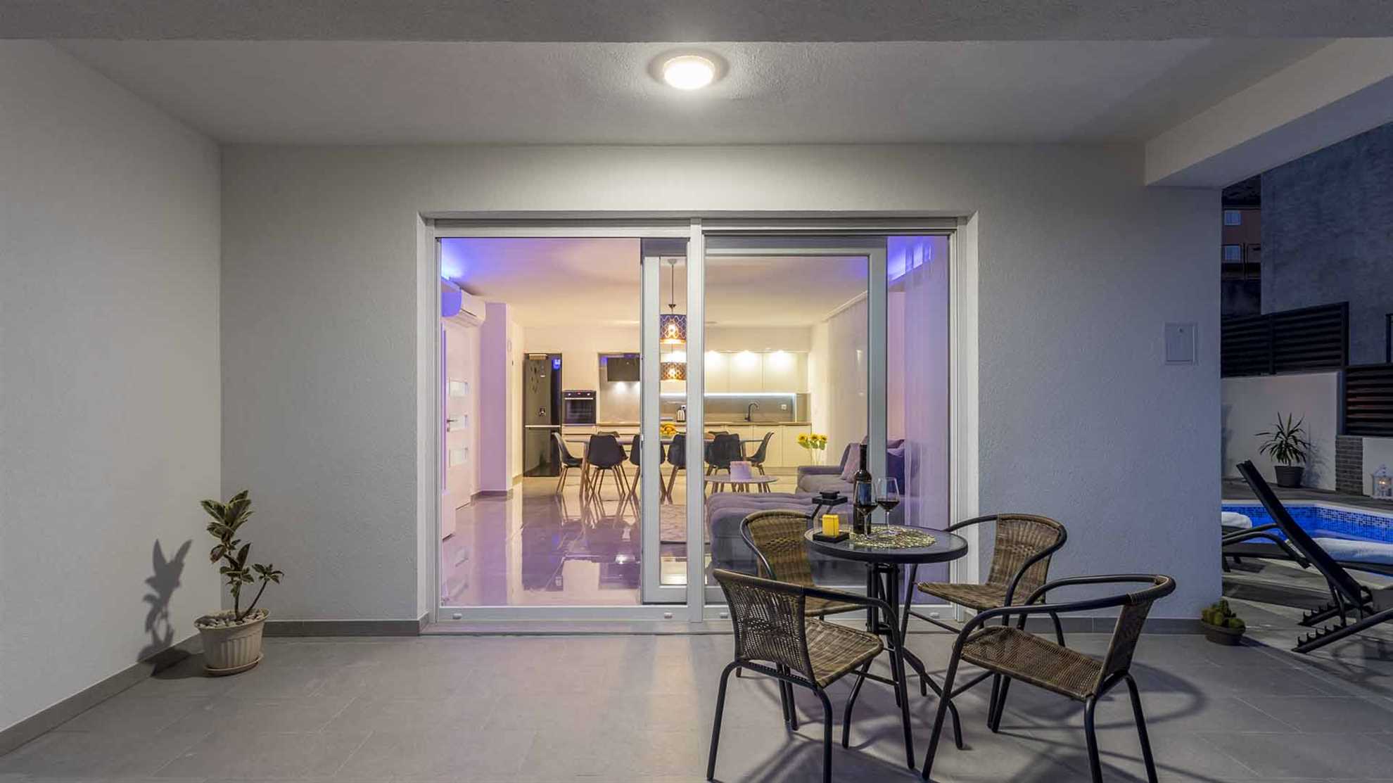 A modern villa in Podstrana with a pool