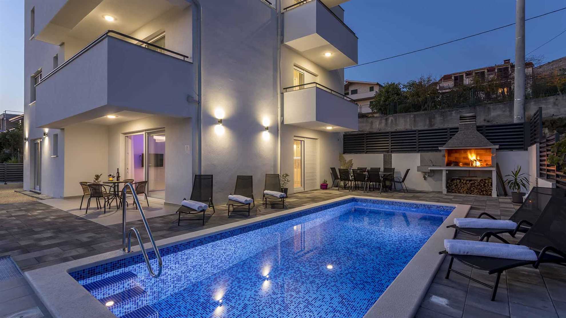 A modern villa in Podstrana with a pool