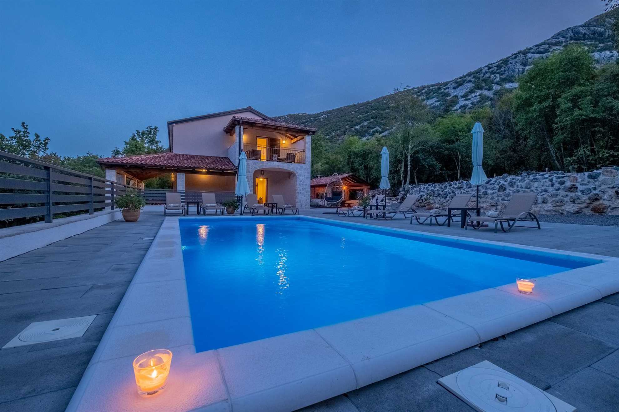 Traditional poolside villa surrounded by nature