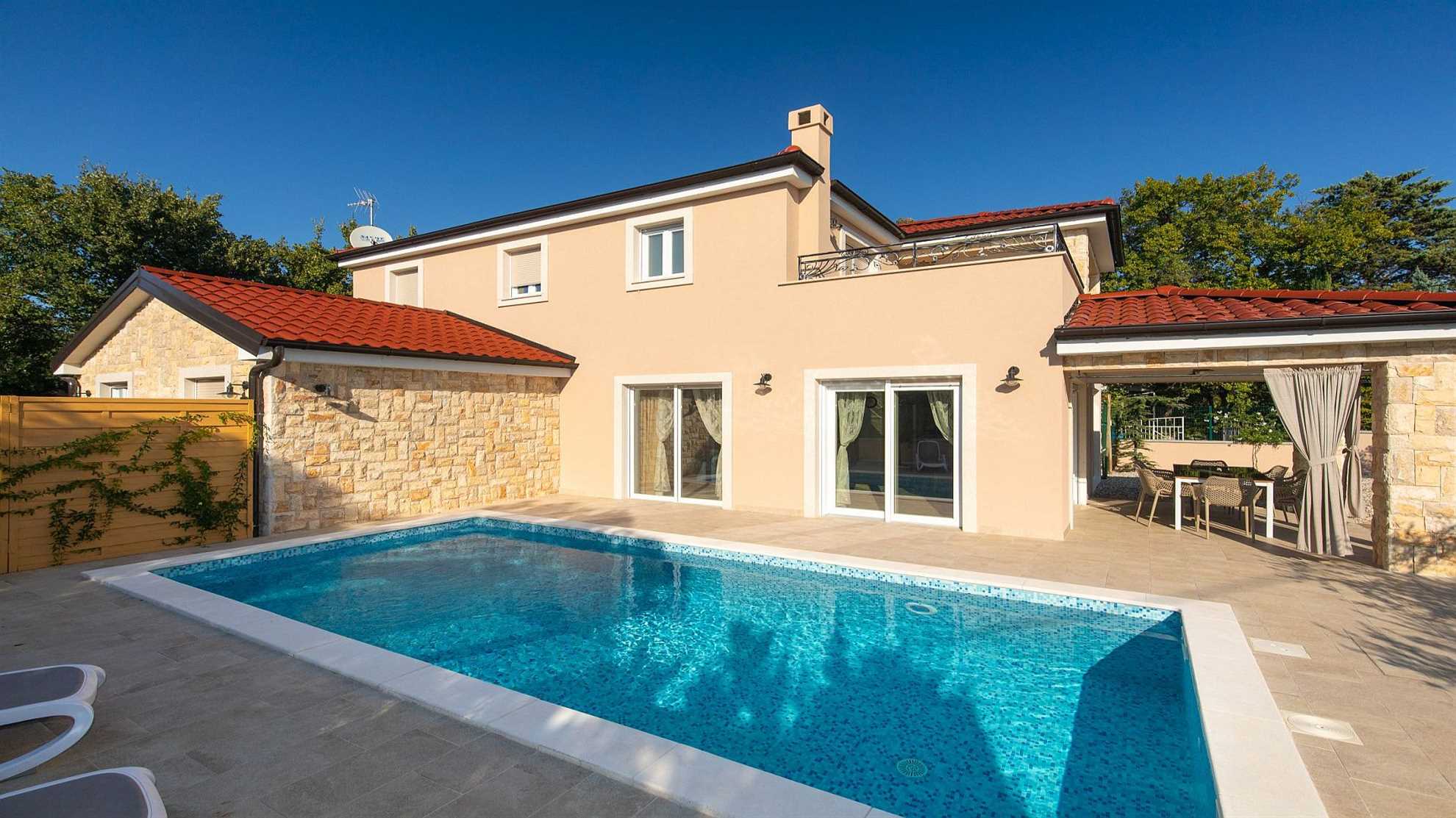 A modern poolside villa on the island Krk