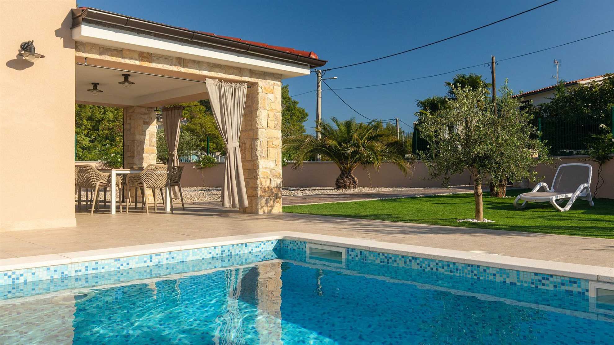 A modern poolside villa on the island Krk