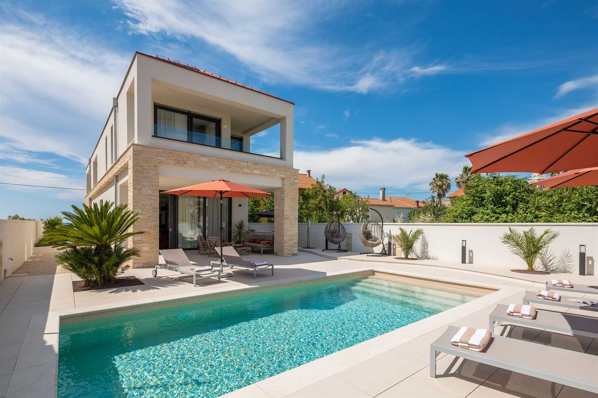 Luxurious beachfront villa with swimming pool