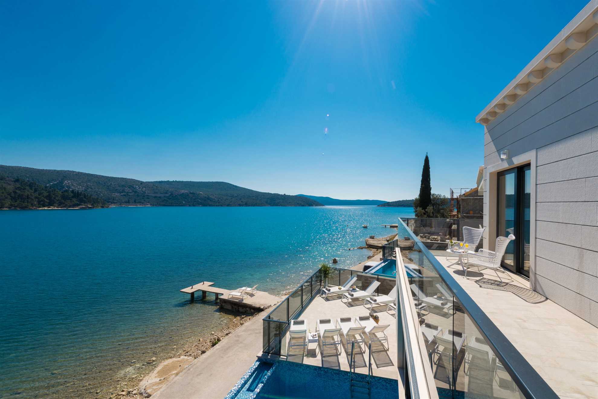 Beachfront Villa Suprema with Pool