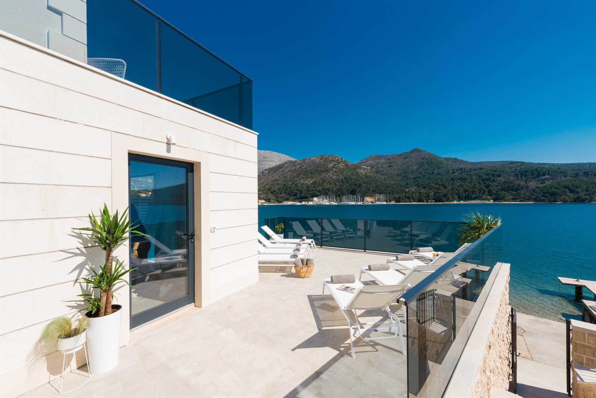 Beachfront Villa Suprema with Pool